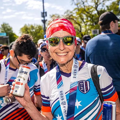female finisher with la colombe beer