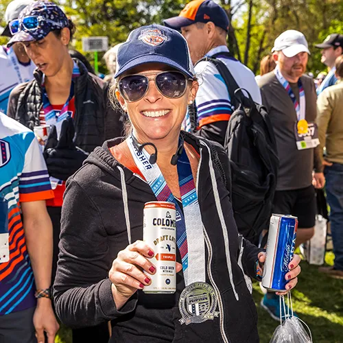 female finisher with la colombe beer