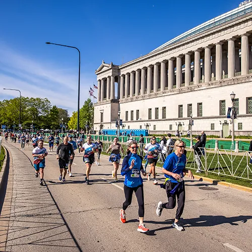 running past historical Chicago building