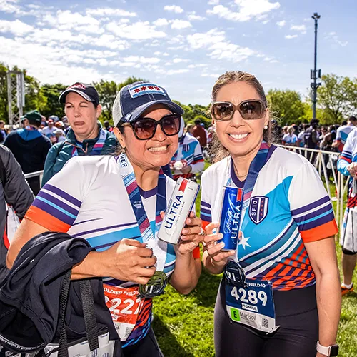2 female finishers with beers