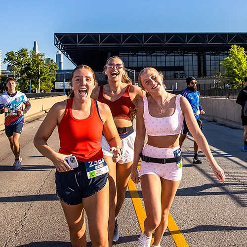 2 women happily running
